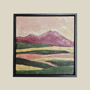 Acrylic painting on canvas featuring a landscape with maroon hills, soft pink skies, and green and golden fields, framed in a minimalist black frame.